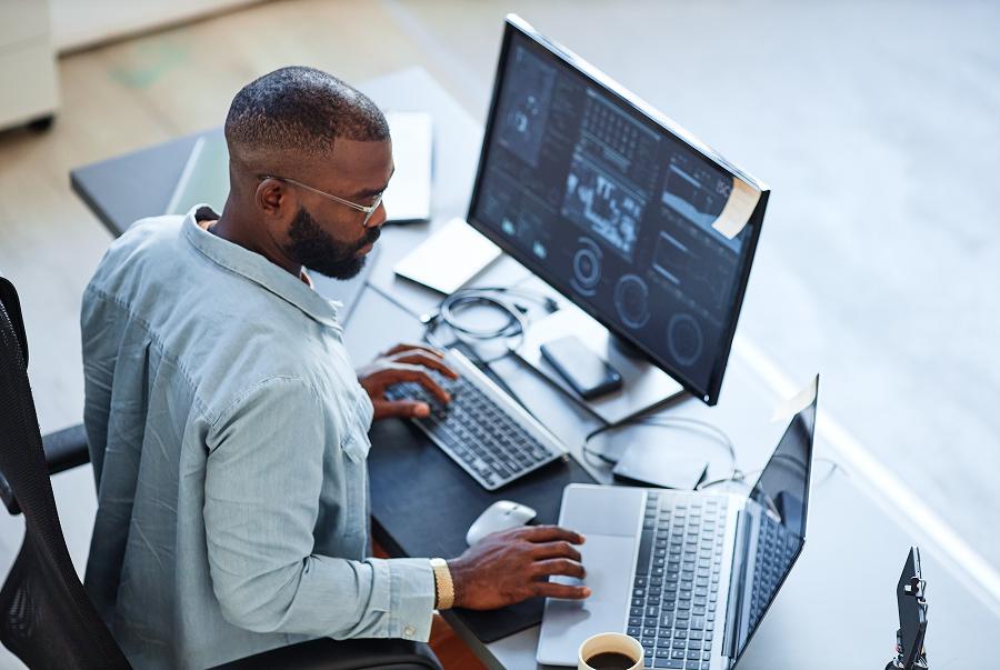 Overhead of researcher working at computer and analyzing data