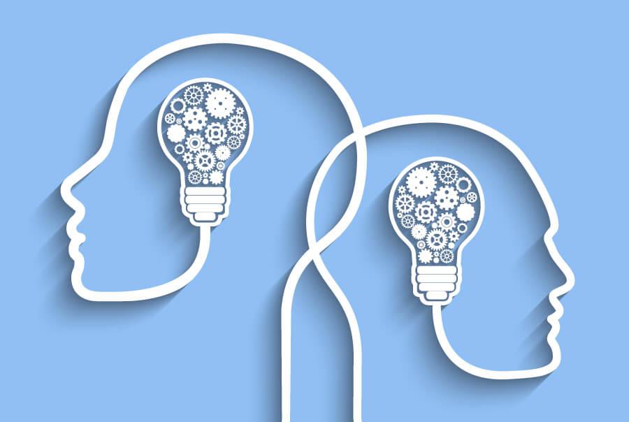 Illustration of Human heads with light bulbs and gears