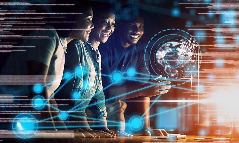 Group of researchers looking at data